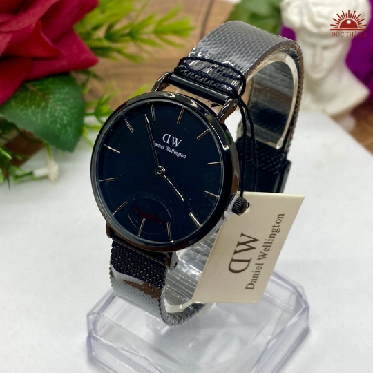 Đồng Hồ DW 0106729  - Vỏ Xi Dây Inox - Full Đen